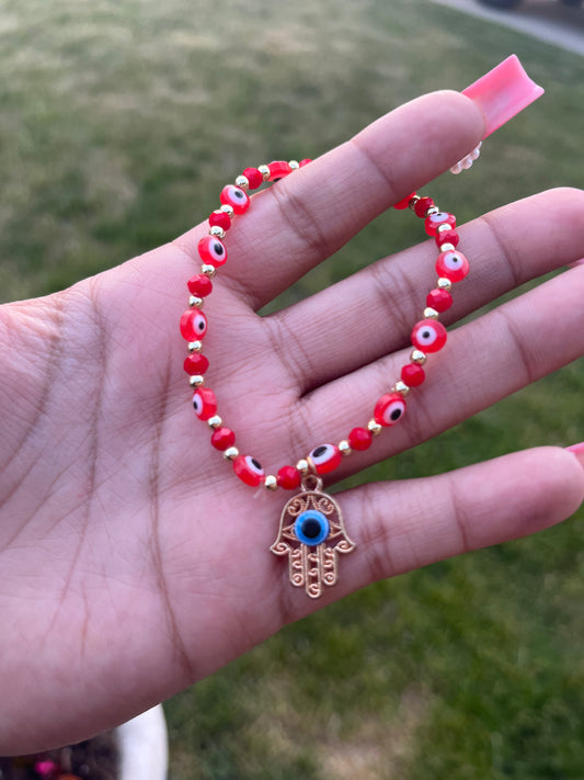 red evil eye hand